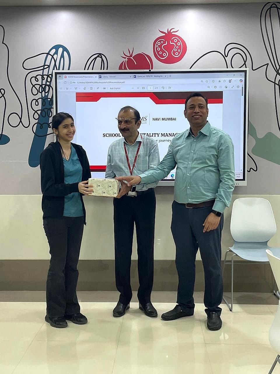 Keya receiving her Masterplate award at NMIMS