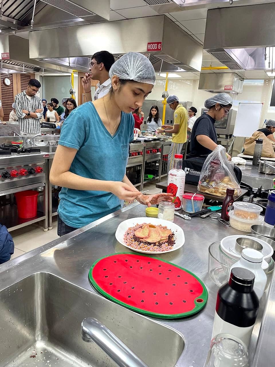 Keya plating Lotus Bloom at the Masterplate competition